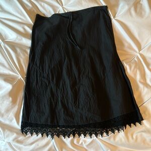 Cotton knee length skirt from Italy in black with lace trim hem in front medium